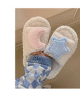 Creamy white fluffy plush home slippers with asymmetrical decorations of cute stars and moons